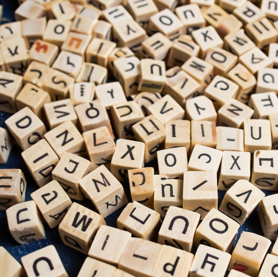 scrabble letters that represent the importance of word choice